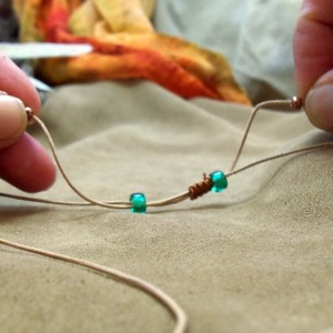 Pull small beads to tighten