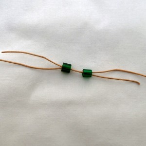 String beads onto other end
