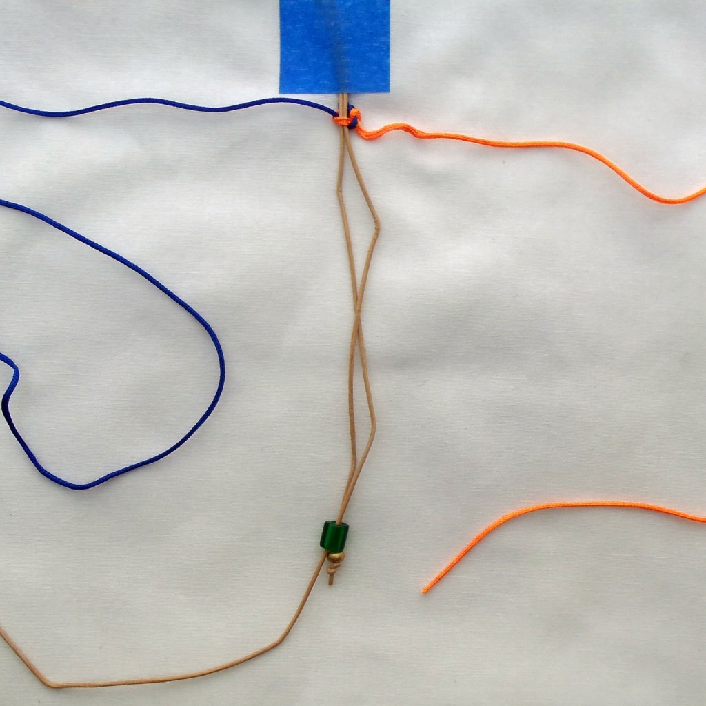 Tighten first half of knot