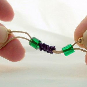 Pull small beads to tighten