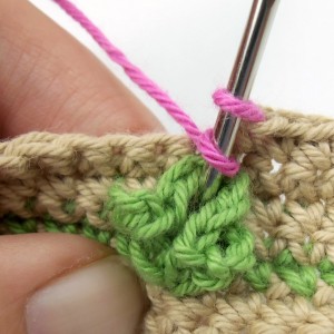 First rose stitch through leaf
