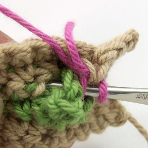 First rose stitch through leaf