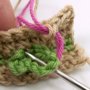 First rose stitch through leaf
